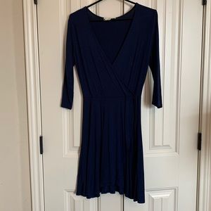 Navy colored, low cut wrap around dress!